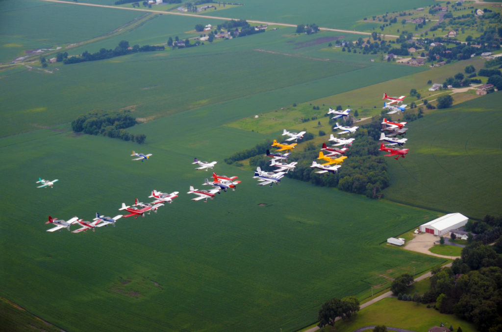 Vans RVs in formation, planes